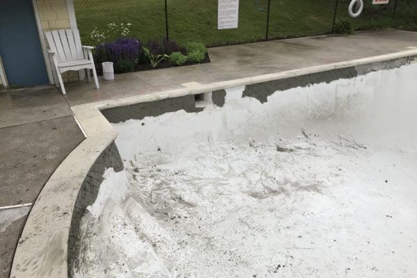 Concrete pool refinishing: before picture